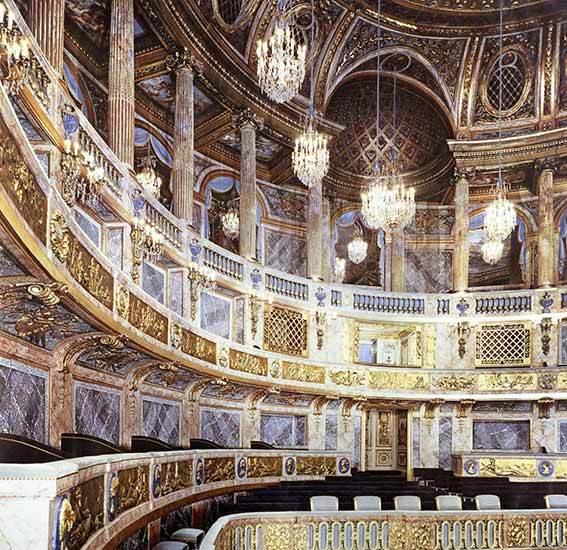 The Chateau de Versailles theater, lighted by Delisle chandeliers from the memory of craftmen and the inventory description from before the French Revolution.